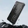 A black phone case with a kickstand is shown in a dramatic, falling pose over rocks, with a blurred sky background. Náhľad obrázku produktu