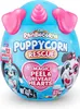 A blue egg-shaped toy package with pink ears and a pink horn, featuring cartoon puppies and text. Anteprima dell’immagine prodotto