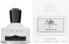 A perfume bottle and its packaging are shown side-by-side against a white background. Voir les images du produit
