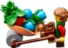 A Lego minifigure pushing a cart filled with fruits and vegetables. Voir les images du produit