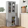 A gray freestanding cabinet with glass doors and a drawer, shown in a kitchen setting. Voir les images du produit