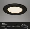 A black LED recessed light fixture is shown mounted on a light gray ceiling. Below the fixture, there are diagrams illustrating the installation process and components. Produktbild-Vorschau