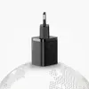 A black USB-C charger with the Baseus logo and '20W' marking sits on a stylized globe. Produktbild-Vorschau