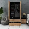 A bedroom scene featuring a wardrobe and a nightstand. Produktbild-Vorschau