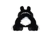 A stuffed toy rabbit seen from the back, sitting down. Náhled obrázku produktu