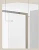 Close-up view of a white cabinet or shelf unit, focusing on the doors and top surface. Produktbild-Vorschau