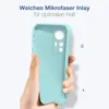 A hand holding a light blue phone case against a white background. Produktbild-Vorschau