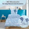 A child's bed with Disney Frozen themed bedding, featuring snowflakes and character silhouettes. Produktbild-Vorschau