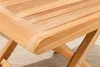 A close-up view of the corner of a wooden table, showing the grain and construction. Produktbild-Vorschau