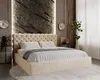 A bedroom scene featuring a large tufted bed. Náhled obrázku produktu