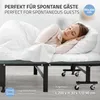 A woman sleeping on a foldable guest bed. Produktbild-Vorschau