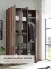 An open wardrobe with clothes and folded towels inside, with a marketing overlay at the bottom. Produktbild-Vorschau