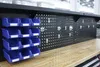A workbench with a pegboard and storage bins. Produktbild-Vorschau