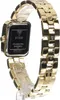 A close-up, angled view of the back of a gold Guess watch. Anteprima dell’immagine prodotto