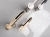 A top-down view of several faucet handles in different finishes. Anteprima dell’immagine prodotto