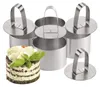 A set of stainless steel dessert rings with a small dessert in the foreground. Produktbild-Vorschau