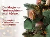 A green Christmas ornament shaped like a house hangs on a decorated Christmas tree. Voir les images du produit