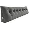 A gray triangular backrest cushion with button tufting and a side pocket for a phone. Produktbild-Vorschau