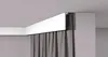A white decorative molding strip installed on a ceiling corner, with gray curtains hanging below it. Anteprima dell’immagine prodotto