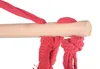 A close-up view of red ropes tied to a wooden bar, likely part of a hanging chair or hammock. Náhled obrázku produktu