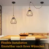 Two pendant lights hang over a wooden dining table with chairs and a bowl of decorative fruit. Anteprima dell’immagine prodotto