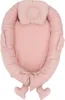 A pink baby nest with a small pillow attached. Produktbild-Vorschau