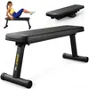 A woman is using a black flat bench for abdominal exercises. The bench is also shown from different angles. Produktbild-Vorschau