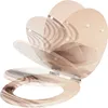 A toilet seat and lid with a sand dune pattern, shown in multiple open positions. Produktbild-Vorschau