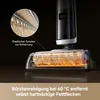 Close-up of a vacuum cleaner head with a magnified inset showing a detail of the brush roll and text overlays explaining features. Produktbild-Vorschau