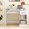 A white desk with a laptop, keyboard, books, and a digital clock. Podgląd zdjęcia produktu