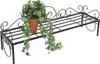 A black metal plant stand with a potted ivy plant on it, set against a white background. Anteprima dell’immagine prodotto