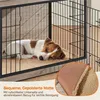 A dog sleeping in a dog crate with a mat. Produktbild-Vorschau