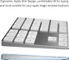 A close-up, angled view of a silver wireless keyboard with white keys, and a side profile view of the keyboard showing its slim design. Náhled obrázku produktu