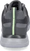 The back view of a gray athletic shoe with a green stripe. Anteprima dell’immagine prodotto