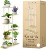 A multi-tiered plant stand filled with various potted plants, shown next to its packaging. Anteprima dell’immagine prodotto
