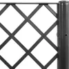 A close-up view of a black metal trellis attached to a dark pole. Produktbild-Vorschau