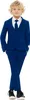 A young boy wearing a blue suit, white shirt, and tie, standing with his hands in his pockets. Anteprima dell’immagine prodotto
