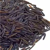 A pile of wild rice grains on a white background. Produktbild-Vorschau