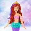 Ariel mermaid doll with accessories against a blurred, sparkly background. Anteprima dell’immagine prodotto