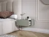 A bedroom scene with a bed and a floating nightstand. Voir les images du produit