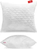 A white quilted pillow is shown from two angles against a white background. Produktbild-Vorschau