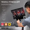 A person is using a smart indoor speedbike with a tablet displaying a fitness app. Produktbild-Vorschau