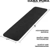 A dark gray stair mat is shown on a white background with dimensions and feature descriptions. Produktbild-Vorschau