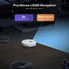 A white robot vacuum cleaner is shown on a tiled floor, with a blue laser grid emanating from it, illustrating its navigation system. Text overlays describe its features. Produktbild-Vorschau