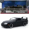 A die-cast model of a black 1995 Toyota Supra from the Fast & Furious franchise, displayed in its original packaging. Podgląd zdjęcia produktu