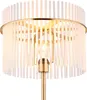 A close-up view of a floor lamp with a gold-colored metal frame and a shade made of clear glass rods. Náhľad obrázku produktu