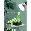 A rotating display stand with cosmetic bottles and a smartphone, illuminated by a ring light, suggesting product photography or live streaming. Náhled obrázku produktu