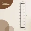 A black metal wine rack is shown against a light beige background, with dimensions indicated by text and lines. Náhled obrázku produktu