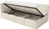 A beige upholstered bed frame with the mattress lifted to reveal storage compartments underneath. Náhľad obrázku produktu