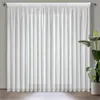 A white sheer curtain hanging in front of a window. Produktbild-Vorschau